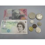 An Australian note, £5 note and coinage inc Olympics boxing 50p