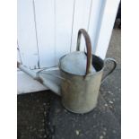 A galvanised watering can