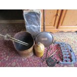 A copper coal bucket, brass fire guard, grate and companion parts plus a Peterborough stoneware
