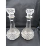 A pair of glass decanters
