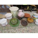 A quantity of planters, vases and ovenware