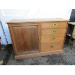 A pine sideboard with cupboard and 4 drawers with brass fixings