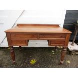 A vintage desk on casters