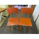 A pair of Zanotta 1960's Italian designer chairs with 'pleather' seating, teak legs and metalwork