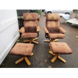 A pair of upholstered chairs and foot stools