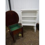 A wooden sewing table and painted bookcase