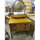 A dressing table with 2 drawers and bobbin legs with decorative handles. mirror isnt original to the