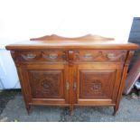 A sideboard with carved detail