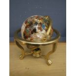 A semi precious stone nautical globe in brass stand. Damaged