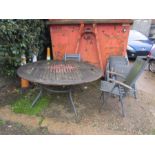 A large garden table with 6 chairs