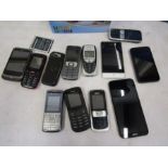 a job lot of mobile phones and sri cam in box