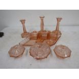 A pink glass art deco style vanity set