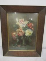 A still life painting of flowers signed bottom left