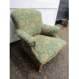 An Edwardian arm chair in pale green