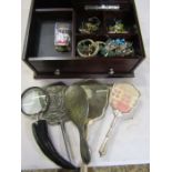 A box containing costume jewellery and dressing table mirrors and brushes