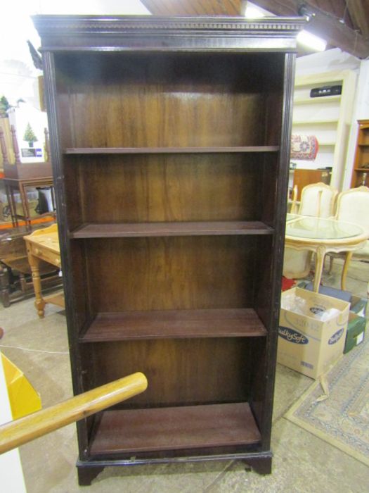 A 6ft bookcase fixing missing for bottom shelf