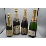 Group of three bottles and one hand bottle of champagne to include Laurent-Perrier, Autreau de