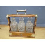 Oak Tantalus with 3 glass decanters and key  (decanters are damaged)