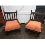 A pair of oak framed deep fireside chairs