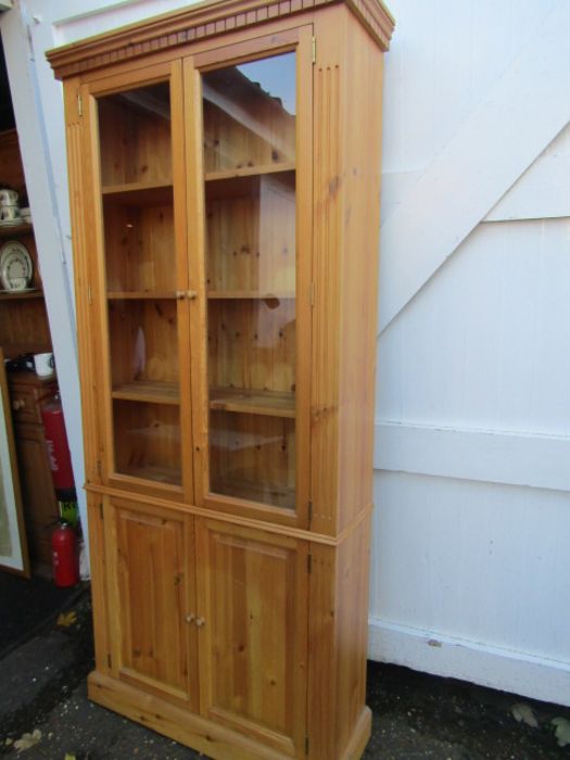 A pine bookcase with cupboard and glazed doors 200cmH 25cmD 89cmW - Image 2 of 2