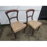 Pair of upholstered mahogany dining chairs