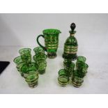 A green and gold glass jug, decanter and glasses set