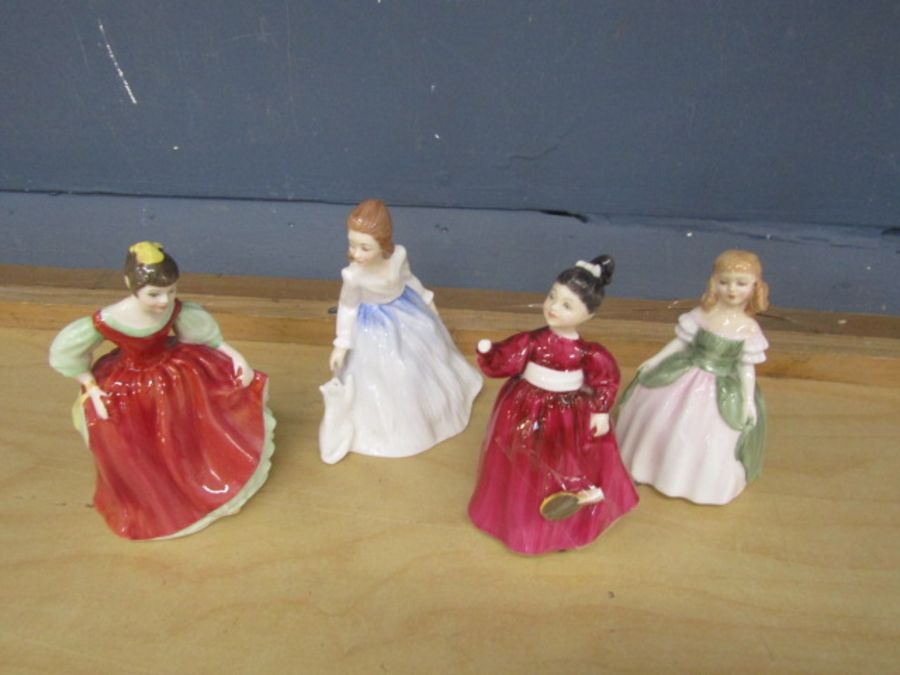 4 Royal Doulton figurines (one has detached hand, but is present as seen in photos)