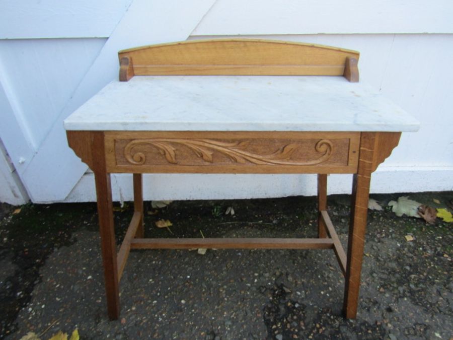 A detailed pine washstand with marble top