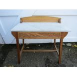 A detailed pine washstand with marble top