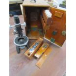 A Cooke, Troughton & simms boxed microscope with accessories