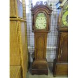 A long cased clock with an enamelled dial striking Bedford Shingham clock face 30cm wide, in