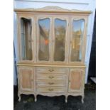 A French style dresser with glass shelving