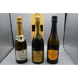 Three bottles of champagne to include Joseph Perrier Brut ChampagneCastellore Prosecco bottle of