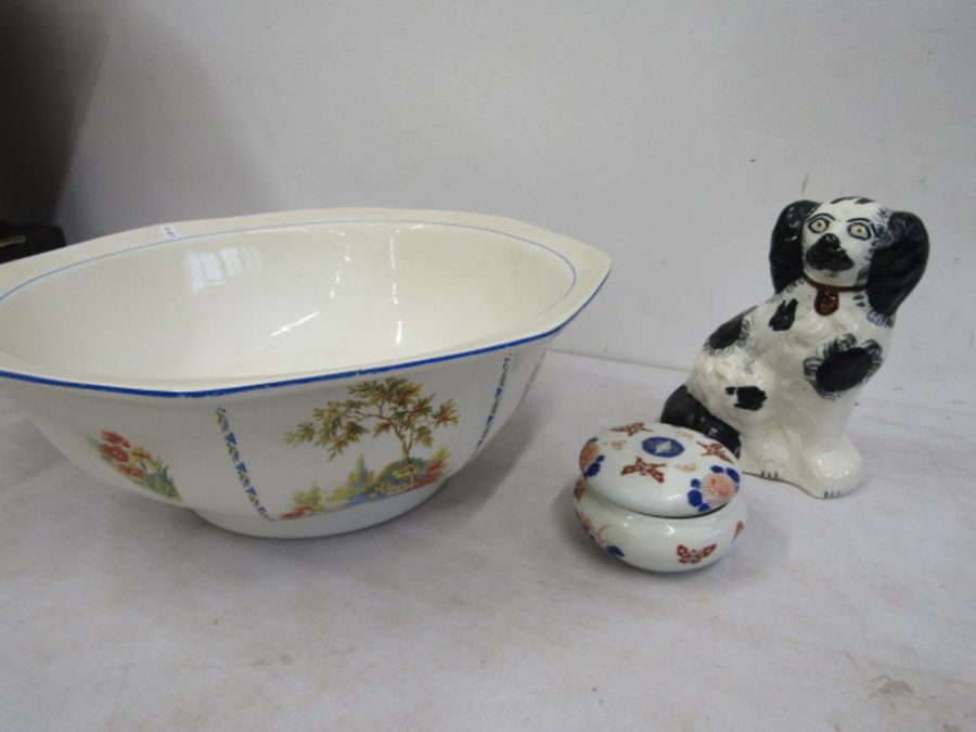 A large bowl ,single mantel dog and trinket pot