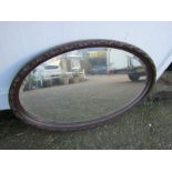 Mahogany bevelled oval wall mirror
