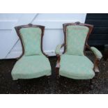 A pair his/hers upholstered vintage chairs