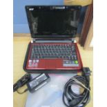 An Acer aspire notebook/ mini laptop with soft case, charger etc