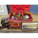 A vintage sewing box with contents