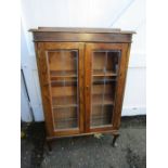 A glazed bookcase with leaded glass