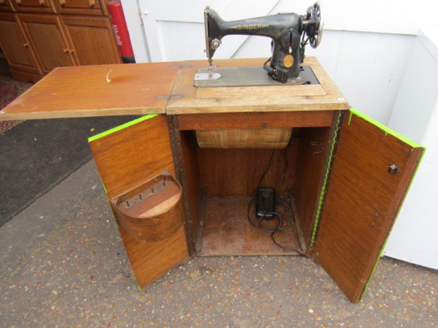 vintage singer sewing machine in cupboard