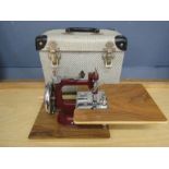 A mini sewing  machine in case