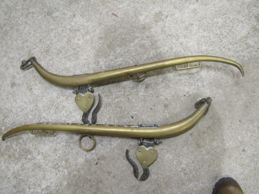 A pair of brass horse haines