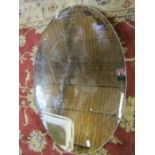 an oval vintage mirror