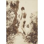 Gloeden, Wilhelm von: Male nude on cliffs