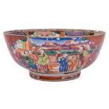A Chinese mandarin palette bowl: the well and exterior painted in bright enamels with panels of