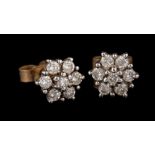 A pair of 9 carat gold diamond cluster ear studs,: set with brilliant cut diamonds, approximately 0.