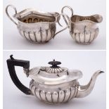 An Edward VII silver three-piece batchelor's tea service, maker Joseph Gloster Ltd, Birmingham,