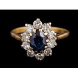 A sapphire and diamond cluster ring:,