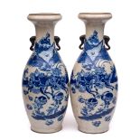 A pair of large Chinese blue and white crackle glazed vases: of baluster form with elephant head