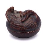 A Chinese brown glazed stoneware goose box and cover: the cover formed as a goose with head folded
